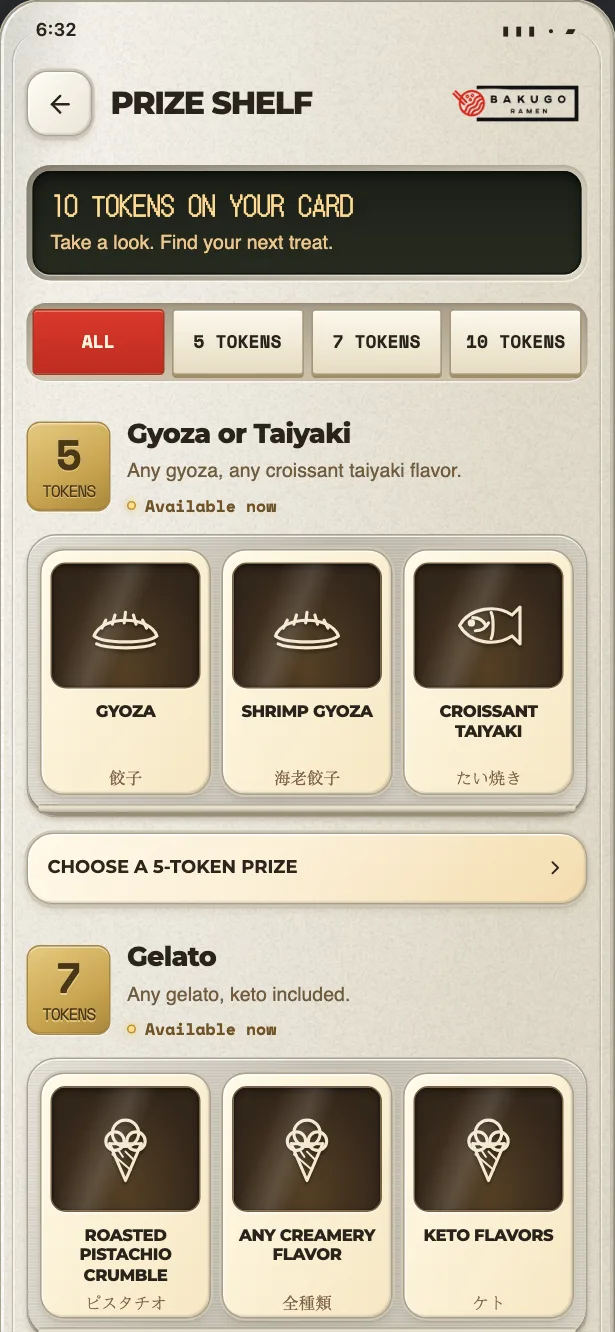The app’s prize shelf: the five, seven and ten token tiers with what each one buys